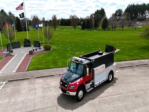 Rhinelander tanker truck, red International chassis with black tank, folding storage and Newton dump chute